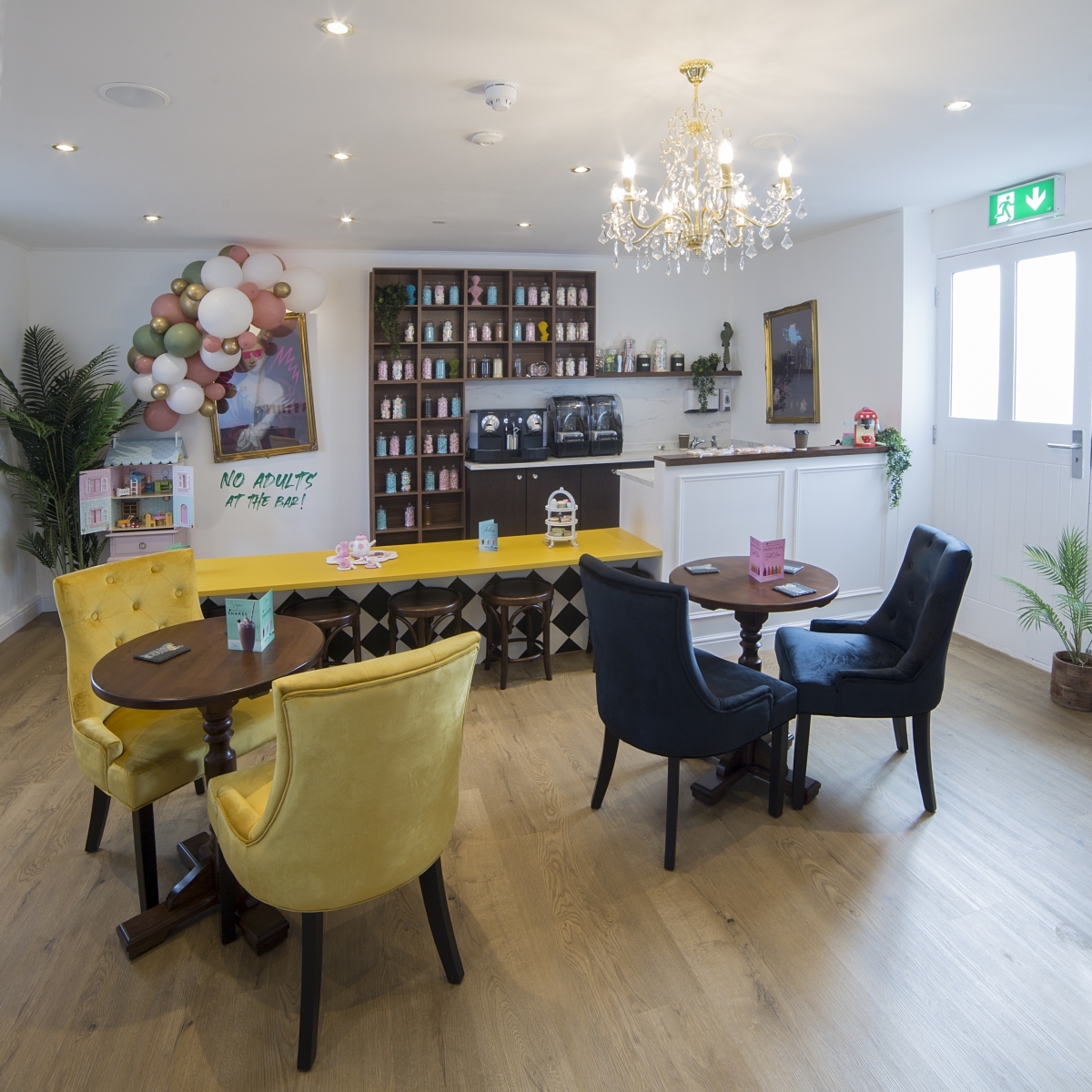 Velvet chairs and tables in the Manor café.